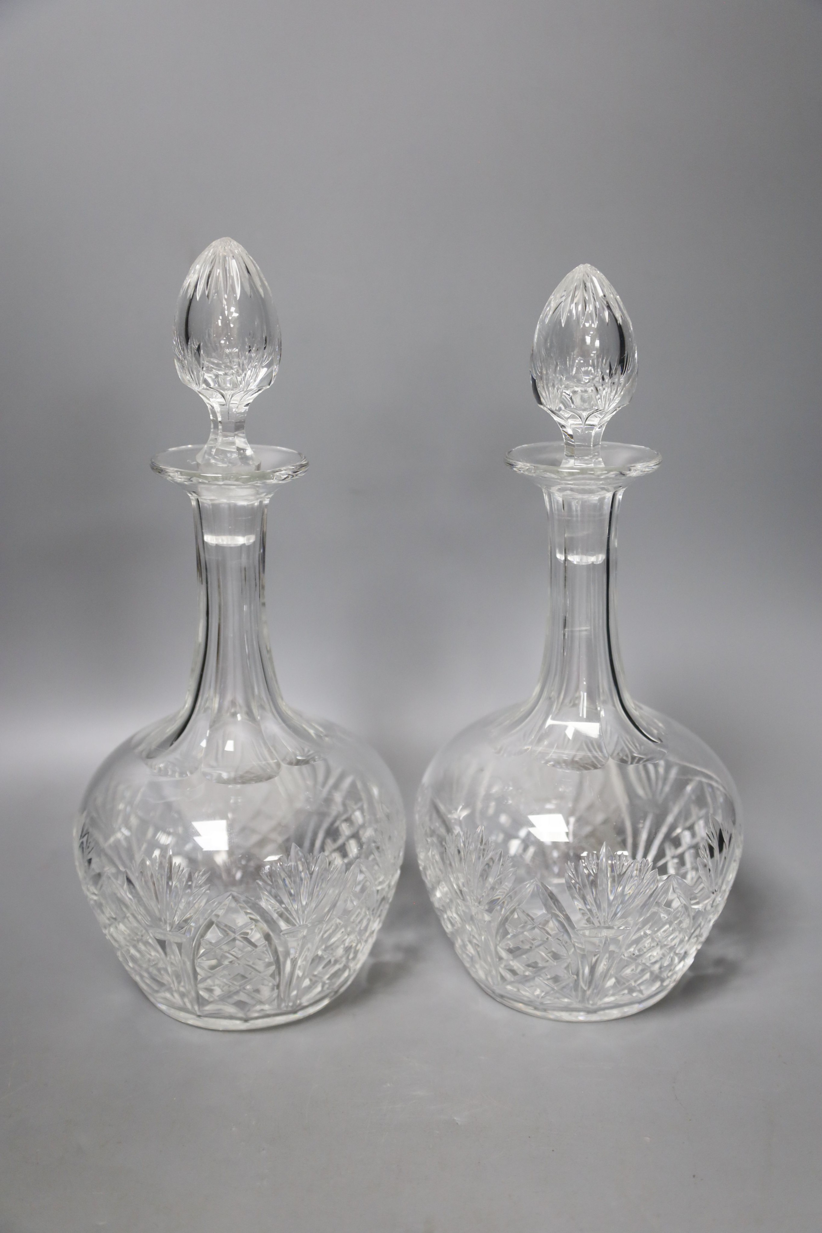 A pair of whisky case decanters and a pair of Victorian decanters 27cm